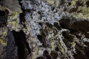 Rock formations and abstract texture on the walls in the Polovragi Cave with stalactites and stalagmites