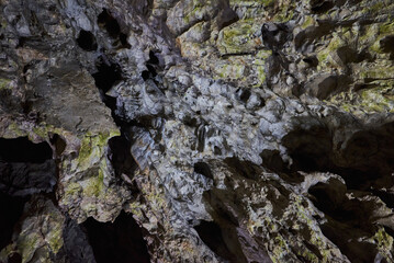 Rock formations and abstract texture on the walls in the Polovragi Cave with stalactites and stalagmites
