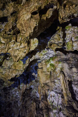 Rock formations and abstract texture on the walls in the Polovragi Cave with stalactites and stalagmites