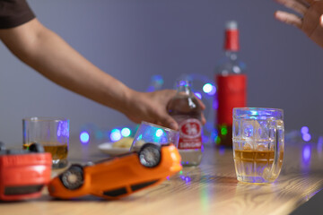 Alcoholic drinks were in goblets and placed on tables within party. Alcohol was consumed by drinkers within party before departed. drinking alcohol in moderation and campaigning against drunk driving.