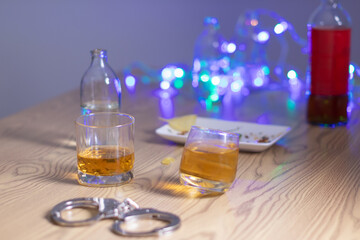 Alcoholic drinks were in goblets and placed on tables within party. Alcohol was consumed by drinkers within party before departed. drinking alcohol in moderation and campaigning against drunk driving.