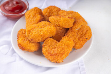 Golden chicken nuggets with ketchup sauce