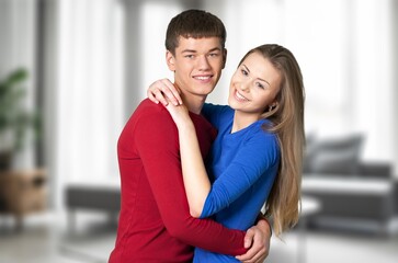 Portrait of cheerful couple lovers enjoying together at home