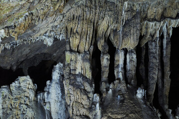 Rock formations and abstract texture on the walls in Muierilor Cave with stalactites and stalagmites