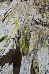 Rock formations and abstract texture on the walls in Muierilor Cave with stalactites and stalagmites