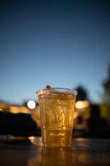 Beer, served in glasses, is a popular alcoholic drink around the world and is often used as a celebratory drink during festivals. Beer was served with ice in beer glasses because of the hot weather.