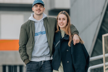 couple of boy and girl on the street outdoors hugging