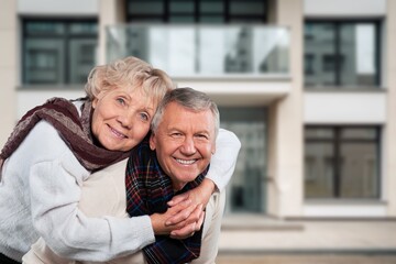 Happy adult couple walking outdoor.