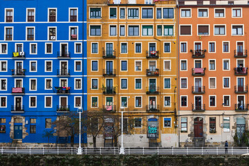 Colorful buildings of Bilbao Spain.  Located  along the Nervion river on a street called Martzana Kaia.