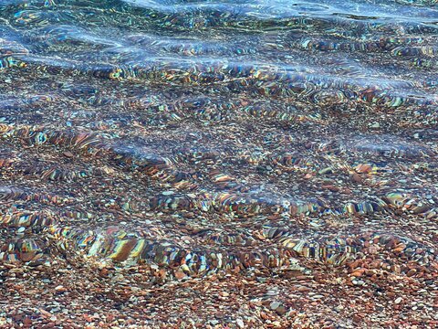 Pebbles in clear water of Mediterranean sea 