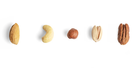 Almond, cashew, hazelnut, pistachio, and pecan nuts in a row on white background