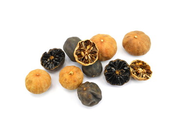 iranian dried whole limes, persian cooking ingredients. dried persian black lime, limu amani isolated on white background