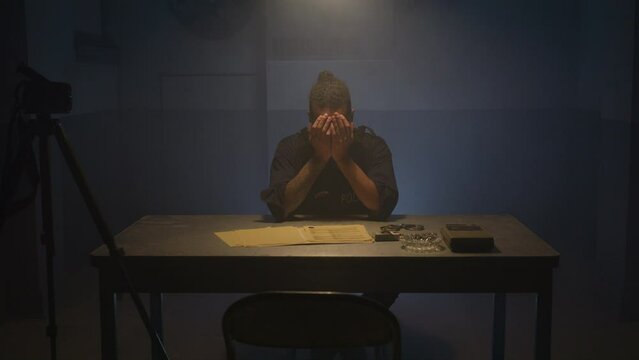 Frustrated police officer in interrogation room