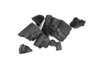 Pieces of broken black wooden coal isolated on white background 
