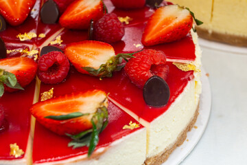 Red fruit sweet dessert cheesecake tart with fresh strawberries