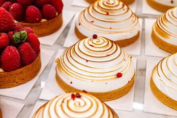 Sweet dessert fresh baked meringue cakes in bakery