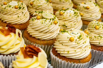 Sweet dessert fresh baked meringue cup cakes in bakery