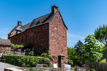 Fototapeta premium Collonges-la-Rouge village, one of the most beautiful villages in France with houses made from red stones, tourists destination in Dordogne