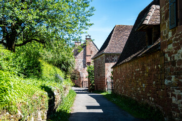 Collonges-la-Rouge village, one of the most beautiful villages in France with houses made from red stones, tourists destination in Dordogne
