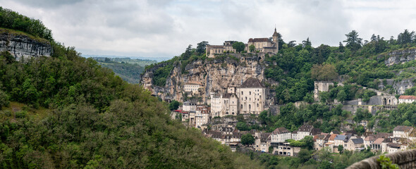 Rocamadour medieval village located on pilgrims route in Lot department in southwestern France, attracted visitors for its setting in gorge above tributary of River Dordogne, panoramic view