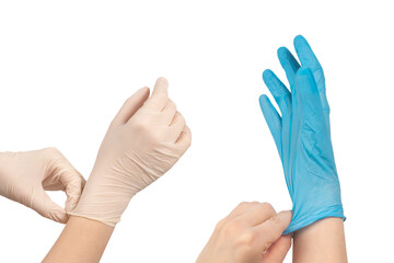 Woman puts on white rubber gloves.