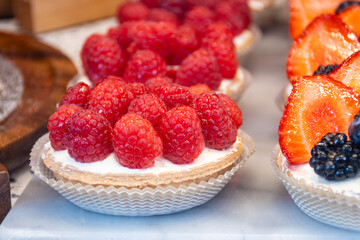 Sweet cake red fruits and berries framboise tartlets with cream