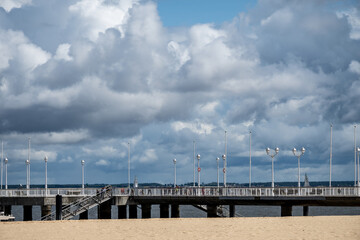 Walking on beach promenade in Arcachon, vacation destination town on Atlantic coast with beatiful...