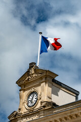 Blue red white french flag on roof of ciry hall in France