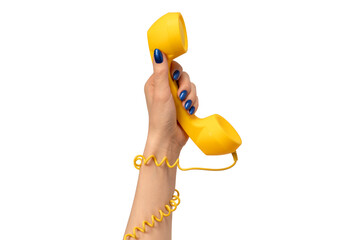 Yellow handset in woman hand isolated on white. Copy space.