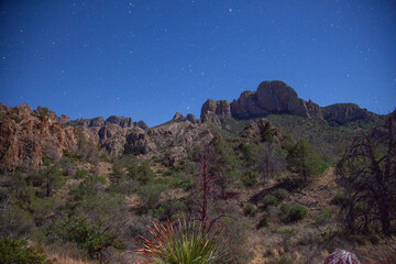 Capturing the ethereal beauty of the Chisos Mountains under a blanket of starlight at Big Bend...