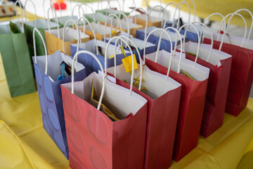 Colorful birthday party bags contains goodies for each guest to take home