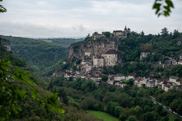Obraz premium Rocamadour medieval village located on pilgrims route in Lot department in southwestern France, attracted visitors for its setting in gorge above tributary of River Dordogne, panoramic view