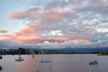 Sunset in Baiona Bay with its small boats in Pontevedra, Galicia, Spain © Uvamenfoto