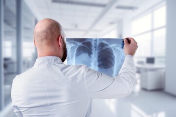 Doctor examining image of X-ray for examination test.