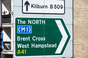 Transportation in London city, roads, road signes, street signes, warnings, indicating of directions in Great Britain, city life in England