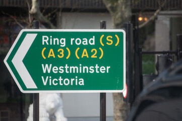 Obraz premium Transportation in London city, roads, road signes, street signes, warnings, indicating of directions in Great Britain, city life in England