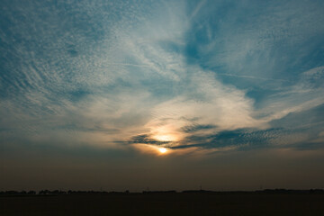Golden Sunset Behind Clouds