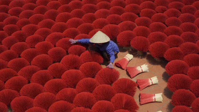 A worker working with incense pattern texture background in Asia, Vietnam. People lifestyle.