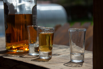 whiskey in glass on a wooden table top stacks
