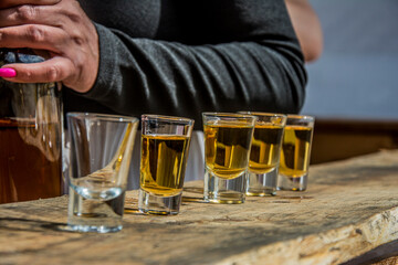 whiskey in glass on a wooden table top stacks