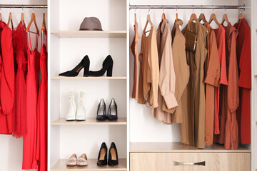 Modern female clothes and shoes in wardrobe at home