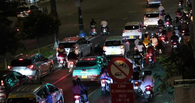 Night motorcycles in Ho Chi Minh City. Crowded Touristic Area with night life in Saigon, Vietnam.