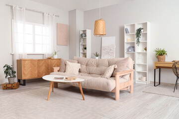 Comfortable sofa and coffee table in interior of living room