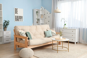 Interior of modern living room with cozy sofa and coffee table