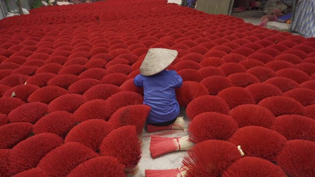 A worker working with incense pattern texture background in Asia, Vietnam. People lifestyle.