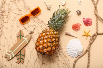 Sunglasses, pineapple, surfboards and seashells on beige background. Summer concept © Pixel-Shot