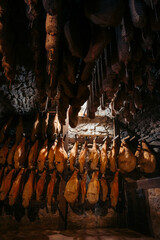 Salami and Prosciutto Hanging from the Ceiling in Kart, Slovenia for an Authentic Culinary Experience