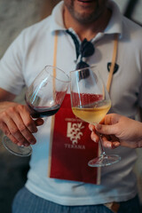 person with glass of wine