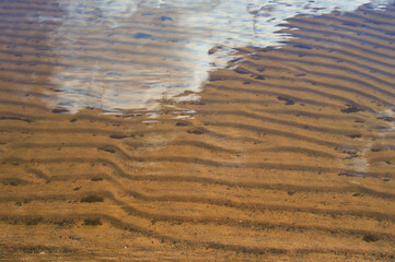 Sand under water.