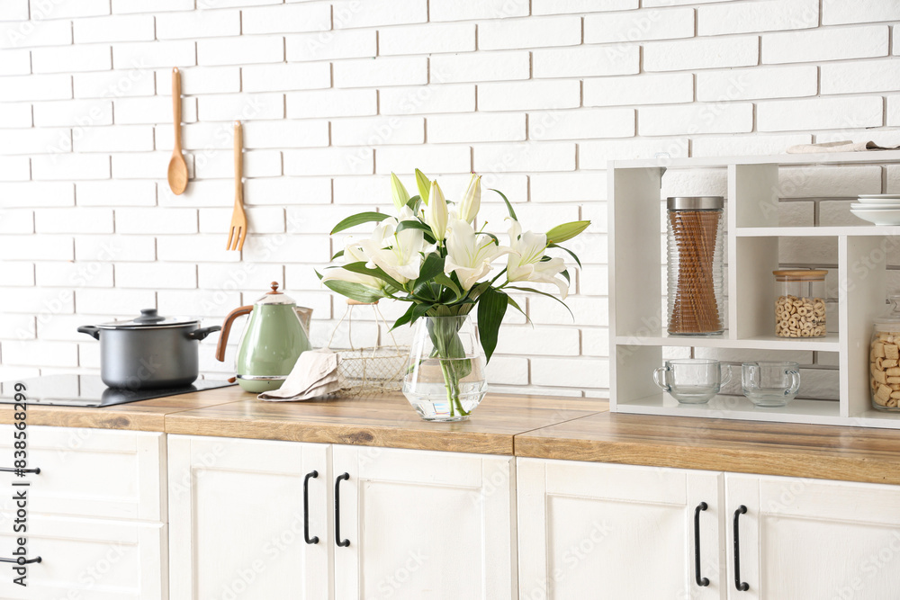 Canvas Prints Vase with beautiful lily flowers on wooden counter in kitchen